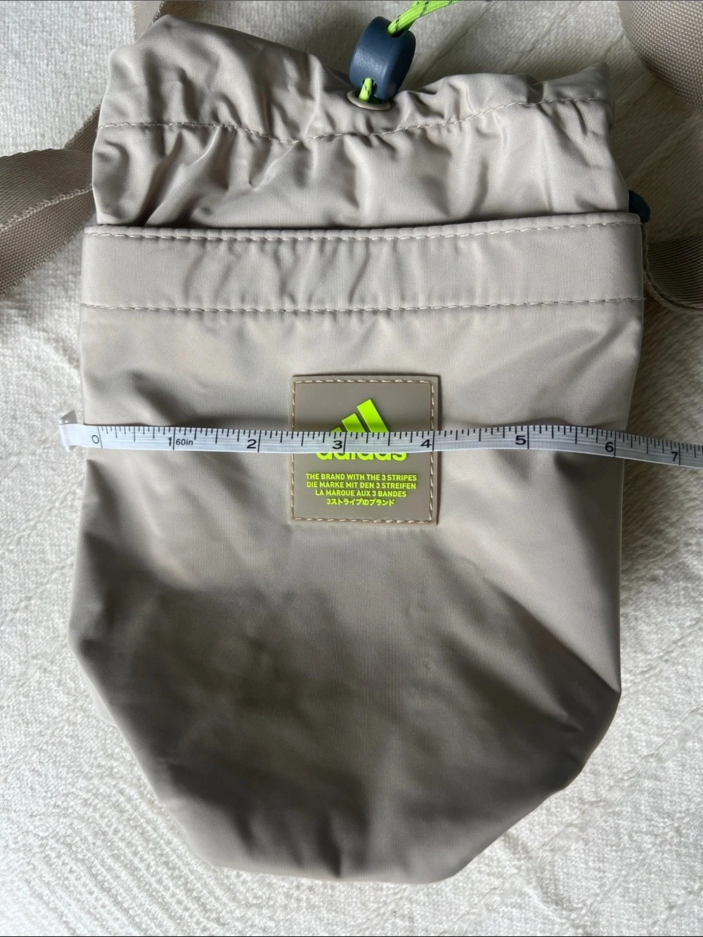Adidas Beige Hydration Pouch with Neon Green Accent, crossbody
